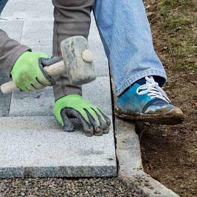 Man installing outdoor path